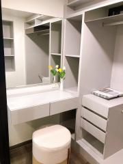 Modern bedroom with built-in closet and makeup vanity