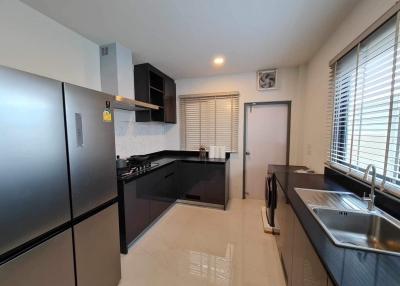 Modern kitchen with stainless steel appliances and ample counter space