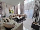 Spacious and elegantly furnished living room with natural light