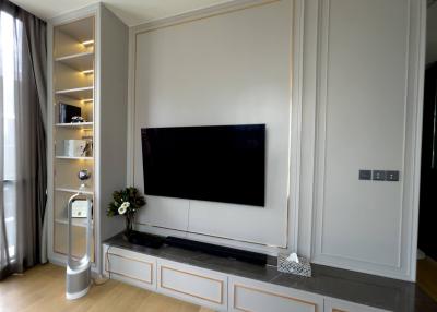 Elegant living room interior with large flat-screen TV