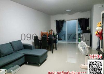 Spacious and Modern Living Room with Dining Area and Balcony Access