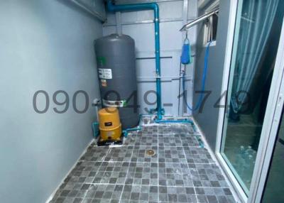 Utility area with water heater and plumbing