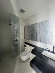 Modern bathroom with walk-in shower and stylish vanity