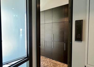 Modern elevator lobby with sleek design and marble flooring