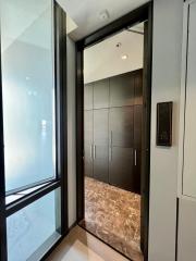 Modern elevator lobby with sleek design and marble flooring