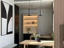 Modern kitchen with cozy dining area and pendant lighting