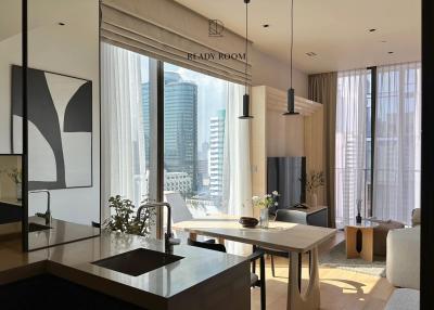 Modern kitchen with city views and integrated dining area