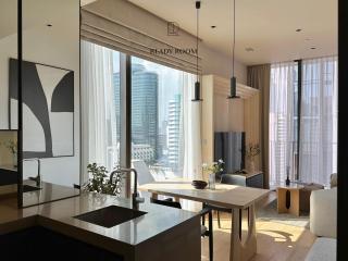 Modern kitchen with city views and integrated dining area
