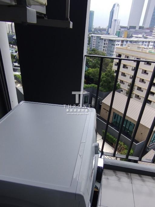 Compact balcony with city view and air conditioning unit