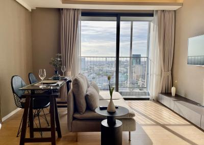 Modern living room with cityscape view through large windows