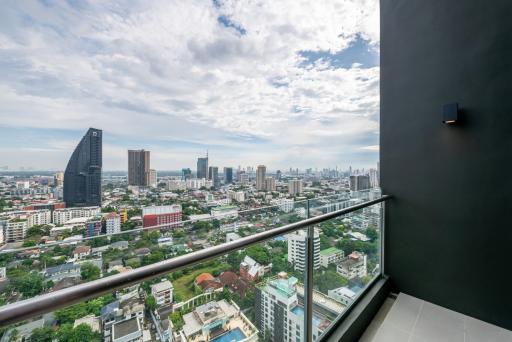 Panoramic city view from high-rise balcony