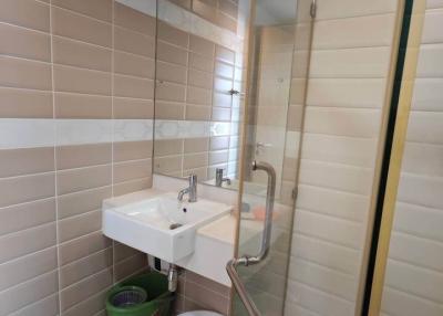 Compact bathroom with glass shower partition