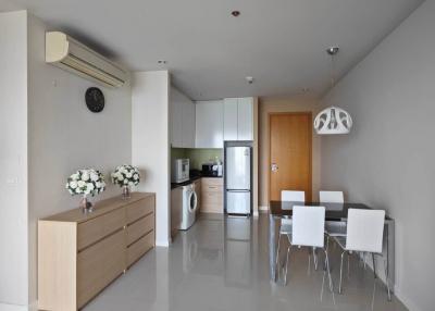 Modern kitchen and dining area with sleek design and clean lines