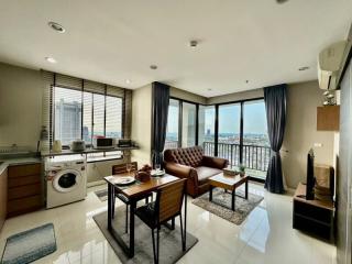 Spacious living room with modern furnishings and city view