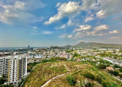 Panoramic view of a cityscape with mountains in the background