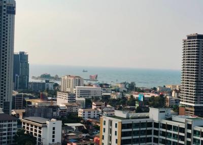 View of a coastal city with high-rise buildings overlooking the sea