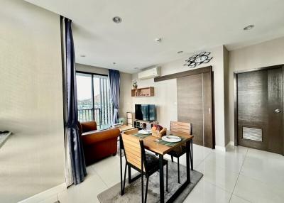 Bright and modern living room with dining area and balcony access