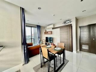 Bright and modern living room with dining area and balcony access