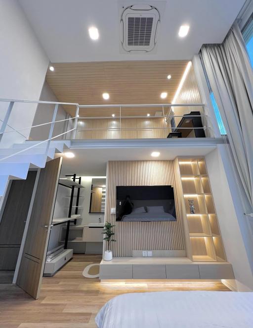 Modern bedroom with mezzanine level and integrated lighting