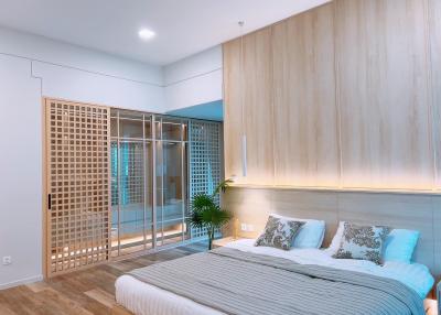 Modern bedroom with wood paneling and ambient lighting