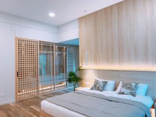 Modern bedroom with wood paneling and ambient lighting