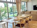 Modern dining room with large windows and natural lighting