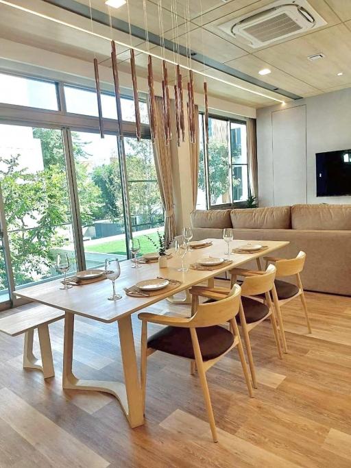 Modern dining room with large windows and natural lighting