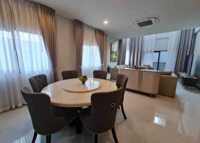 Spacious dining room with modern furniture and open layout