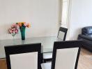 Modern dining area with table set and flowers