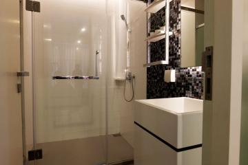 Modern bathroom with walk-in shower and vessel sink