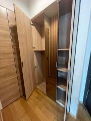 Modern bedroom with open wooden wardrobe