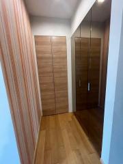 Corridor with wooden wardrobe and curtains