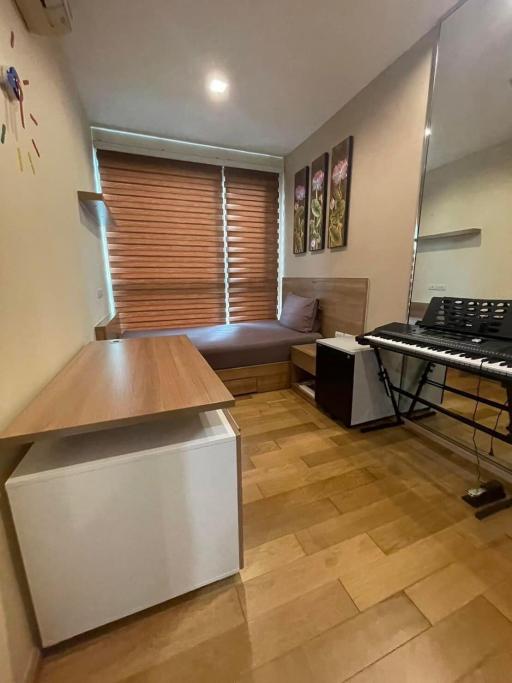 Compact kitchen with modern appliances and wooden flooring