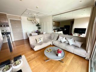 Spacious living room with modern furniture and an open plan kitchen