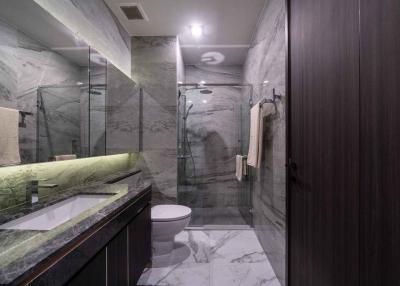 Modern bathroom with marble finish and glass shower