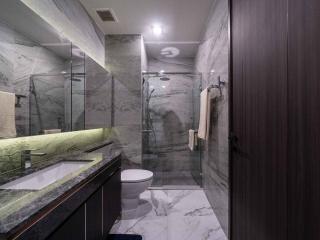 Modern bathroom with marble finish and glass shower