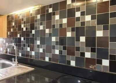 Modern kitchen with glass stovetop and tiled backsplash