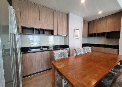 Spacious kitchen with modern appliances and a large dining table