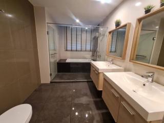 Modern bathroom with glass shower enclosure and double vanity