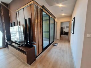 Modern living room interior with glass partition and wooden floors