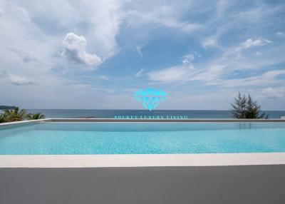 Luxurious infinity pool overlooking the ocean under a clear blue sky