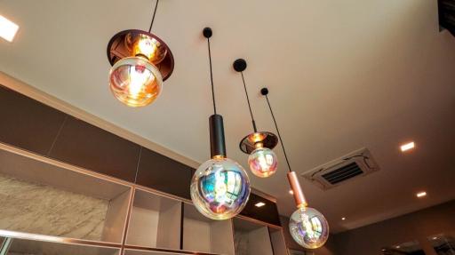 Modern pendant lights with reflective design in a contemporary building interior