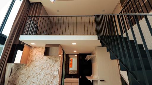 Modern interior design of a duplex apartment with staircase