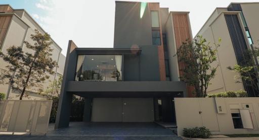 Modern two-story house with garage and landscaped front yard