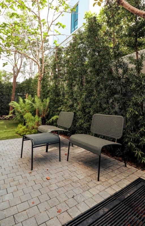 Peaceful garden patio with seating arrangement