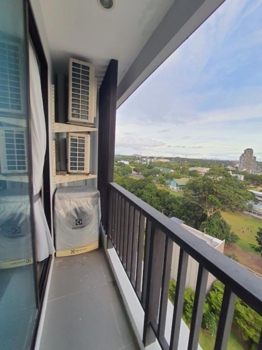 Compact balcony with outdoor view and air conditioning units