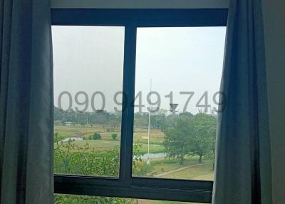 Window view from a room showing green landscape