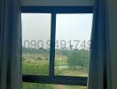 Window view from a room showing green landscape