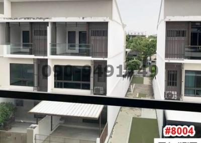 Modern residential townhouses with balconies and private garages