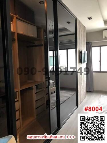 Modern bedroom interior with sliding glass doors and built-in wardrobe
